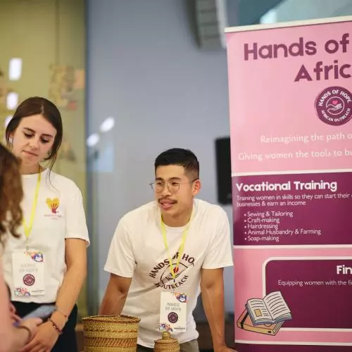 A starup founder talking to an event attendee at their stand