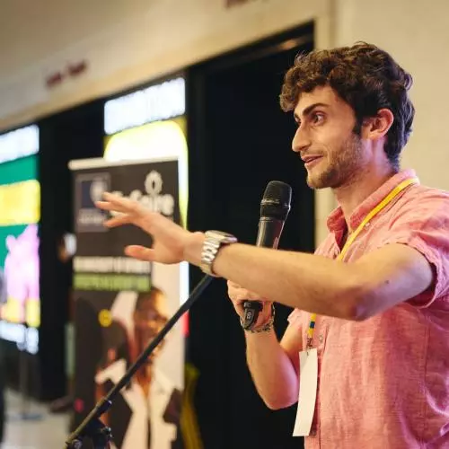a man talking into a microphone
