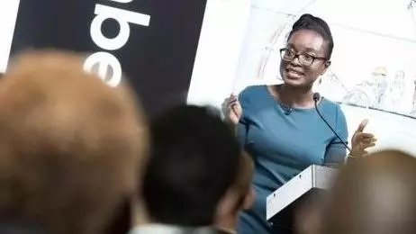 Doyin Atewologun presenting in front of a room
