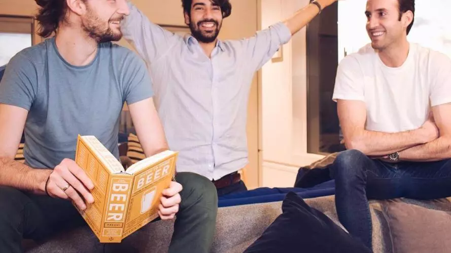 three men sitting