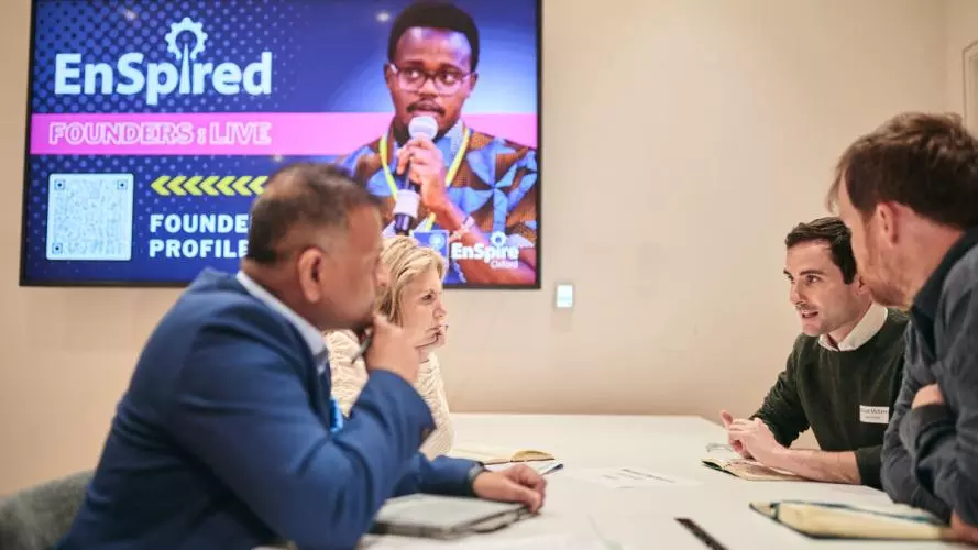 Industry experts sat at a table with aspiring founders giving advice
