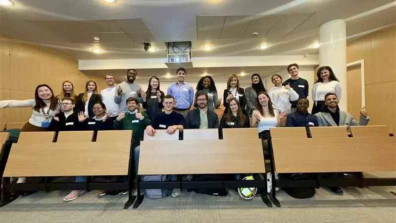 A group of event attendees sitting in an auditorium 
