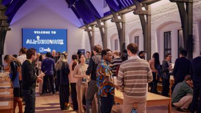 A group of people networking at an event at Reuben College, Oxford