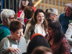 A group of people networking during a conference break
