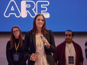 A student pitching at a startup competition event