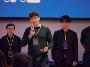 An early stage entrepreneur pitching to an audience