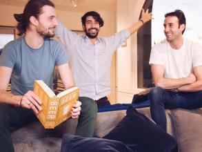 three men sitting