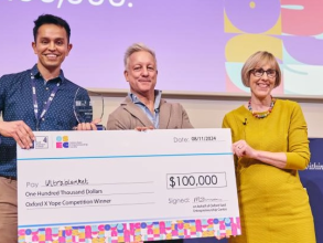 oxford x yope award winner holding his winning cheque at the 2024 OSEF event