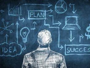 An illustration of a man looking at a chalkboard with idea, success and plan graphics