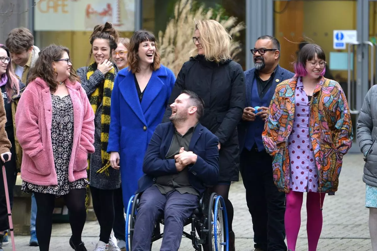 A group of social enterprise UK members laughing and smiling