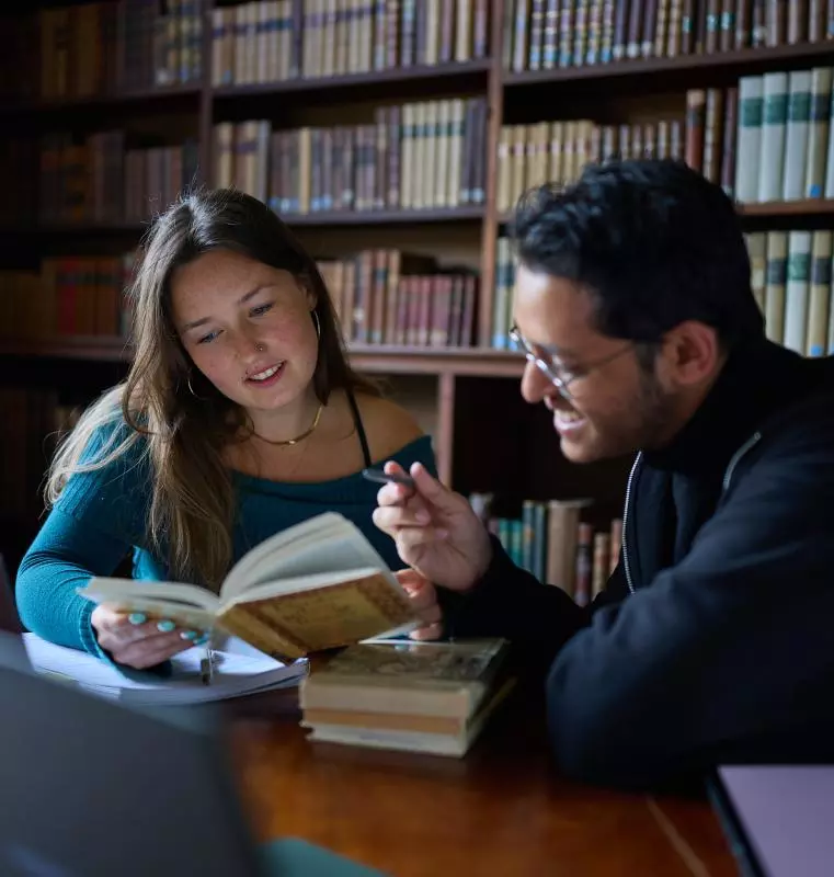  A STUDENT READING A BOOK IN SOMERVILLE LIBRARY